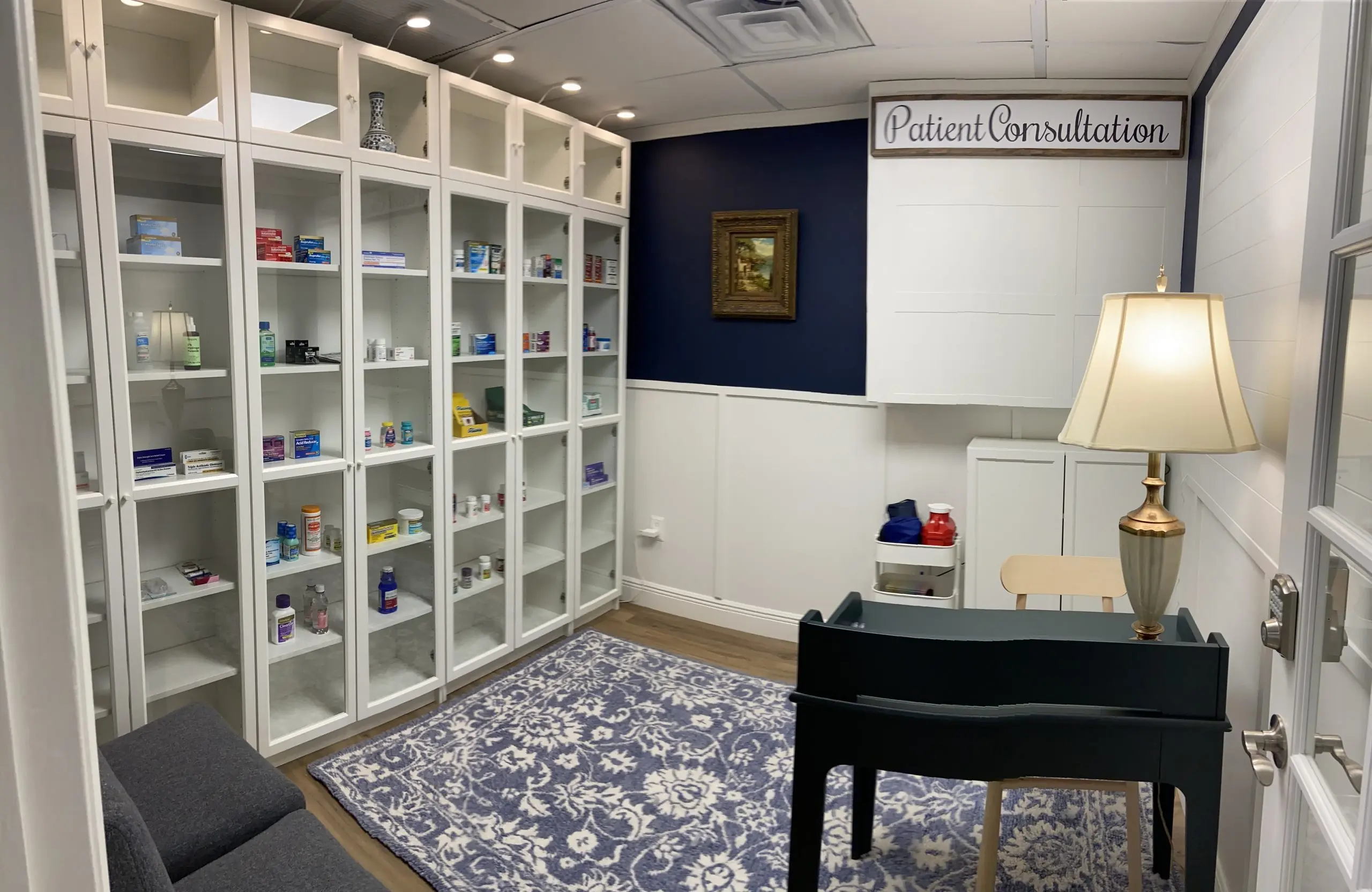Patient consultation room with white cabinets at My Concierge Pharmacy